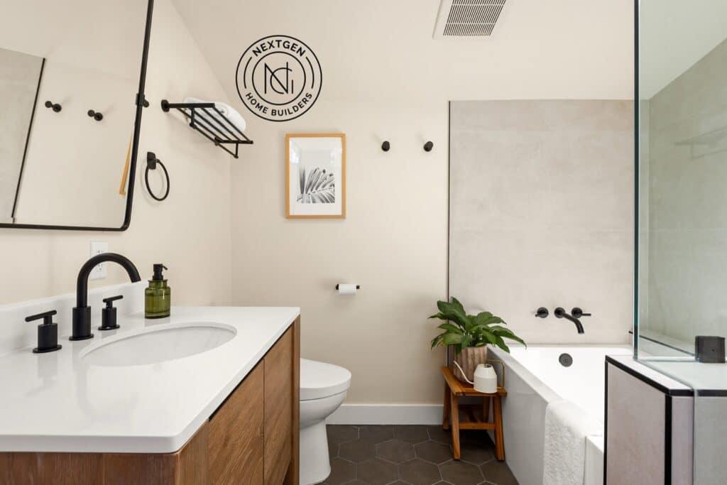 Modern bathroom remodel with wood vanity and black fixtures